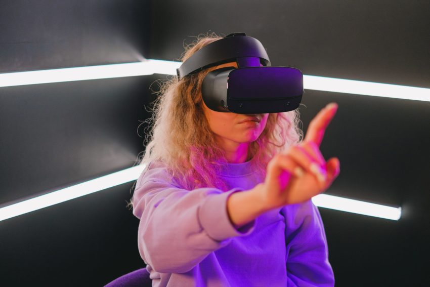 woman playing on a game with vr headset