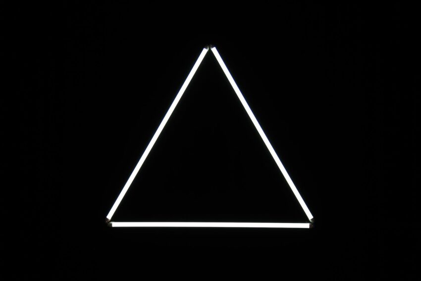 white triangle on black background